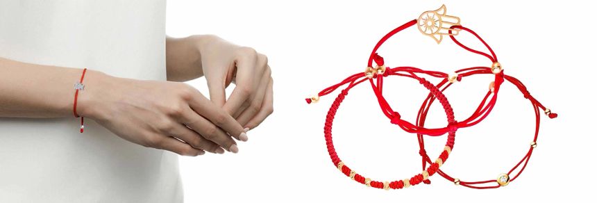 Червона нитка з золотими вставками і срібними вставками, на руку.